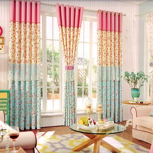 Colorful floral curtains in a bright room with furniture and
